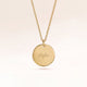 Personalized round gold necklace with space for engraving of text, coordinates or handwriting on the front and back