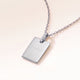 Personalised square silver necklace with white zirconia seen from the side, with years and a heart engraved on the front
