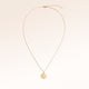 Full round gold necklace with white zirconia laid out flat with a fine adjustable gold chain and round pendant for personalised engraving