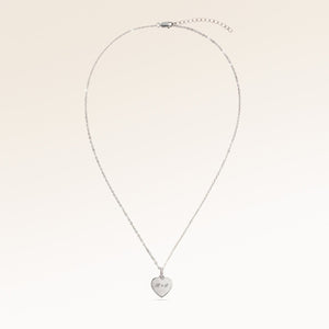 Full heart-shaped necklace in silver fully laid out with fine adjustable silver chain and minimalist heart pendant for personalized engraving