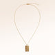 The full rectangular gold necklace with a soft melted look laid out, with a fine adjustable gold chain and a pendant for personal engraving