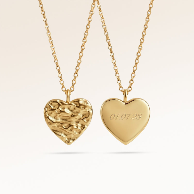 Personalized heart-shaped gold necklace with softly melted finish and space for engraving of text, coordinates or handwriting on the back